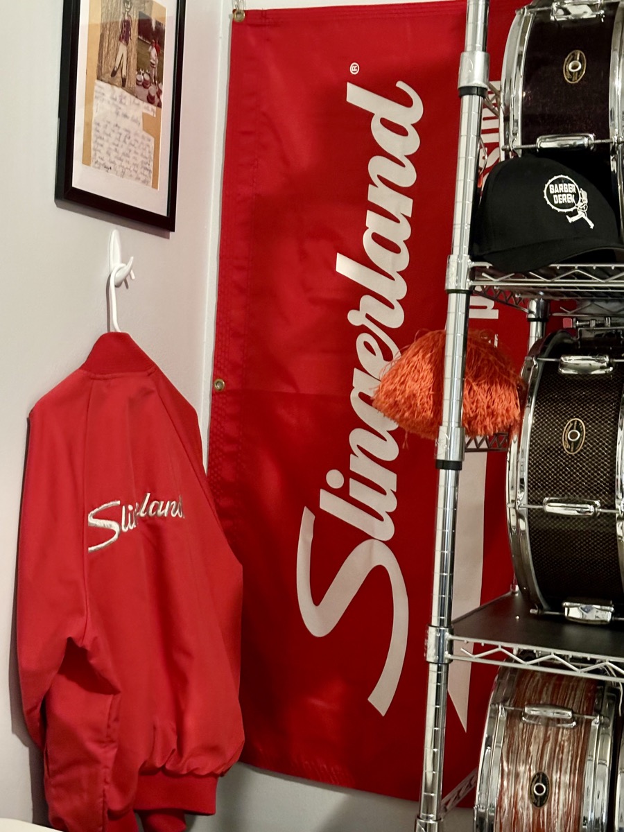 Slingerland banner, jacket, and vintage snare drum
